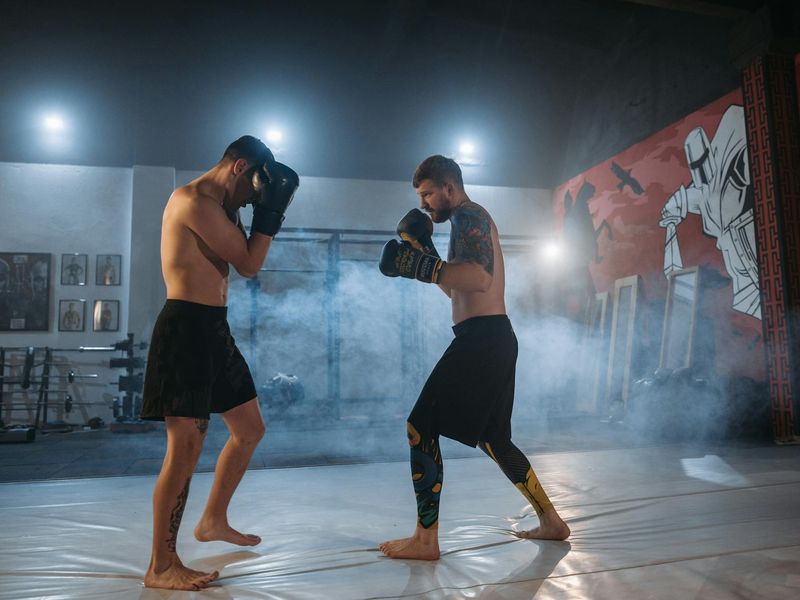 Intense gym training session with focused athlete and green lighting.